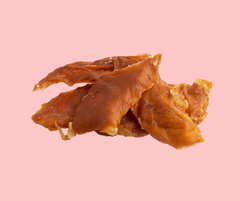 Chicken Jerky Dog Treats on pink background