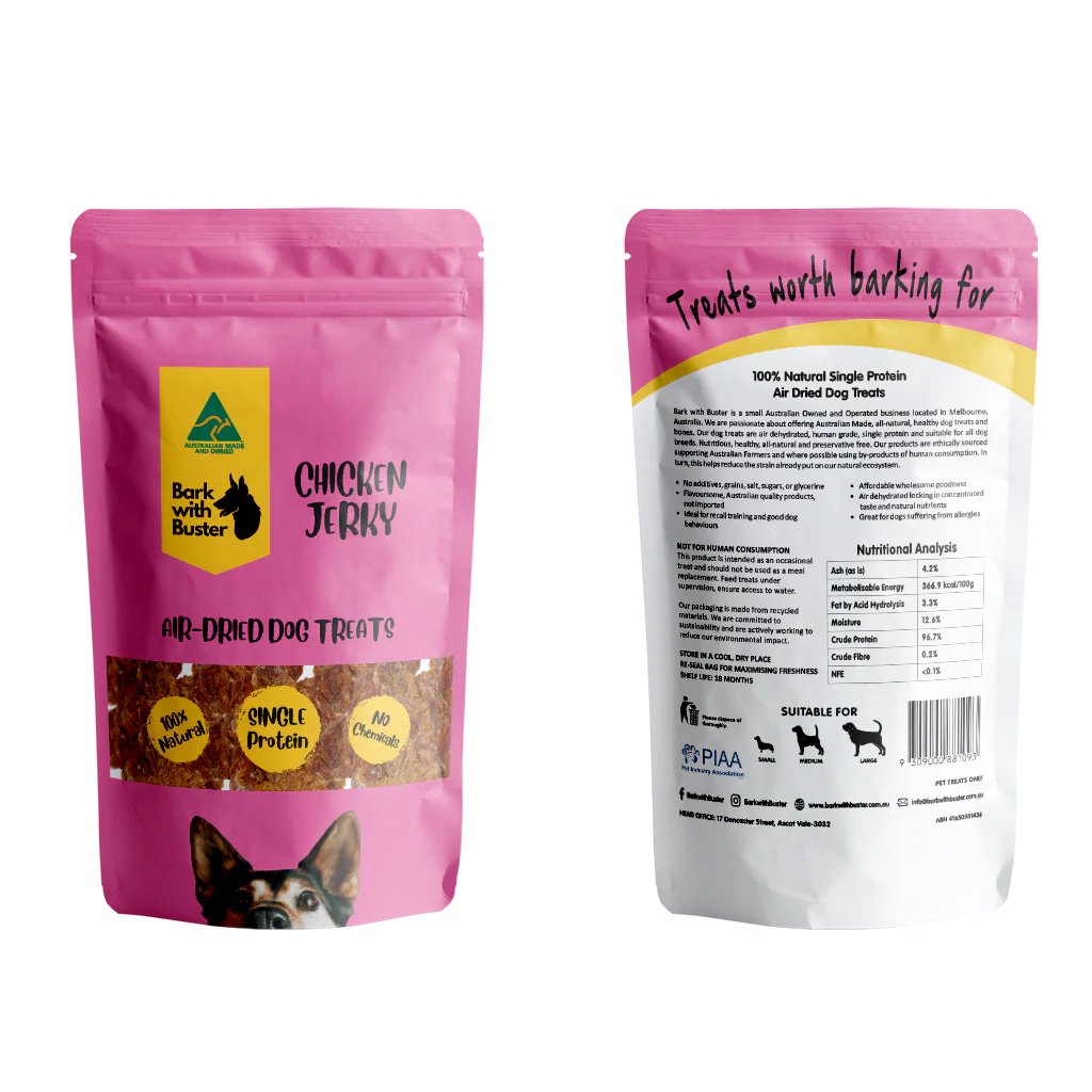 Pink package of air-dehydrated natural dog treats with visible Bark with Buster branding and nutritional information.