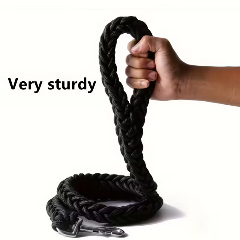 Hand holding a black braided dog rope with a metal clip on a white background, labeled 'Very sturdy'.