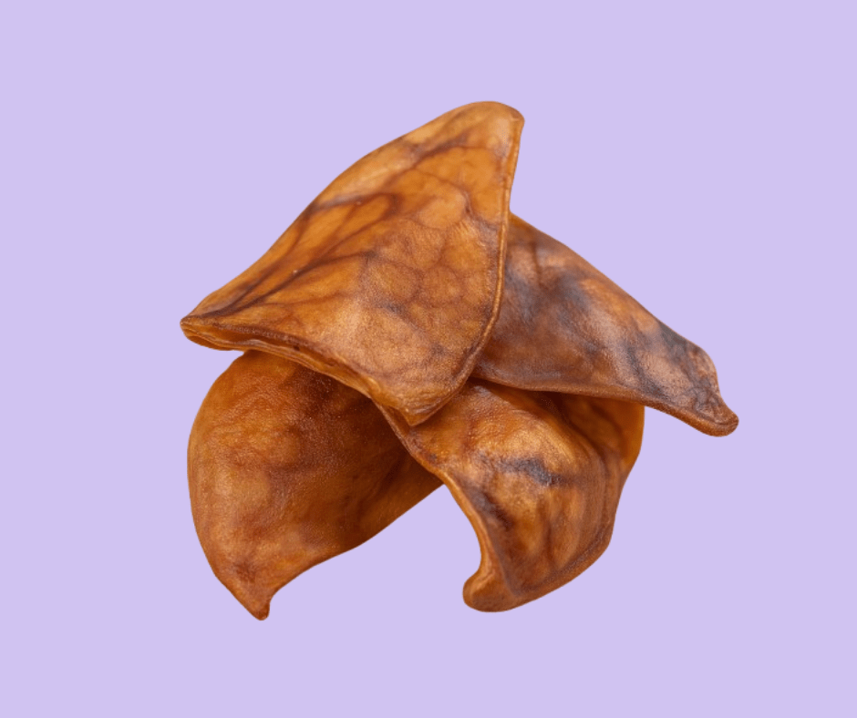 Pig Ears Dog treats on mauve background